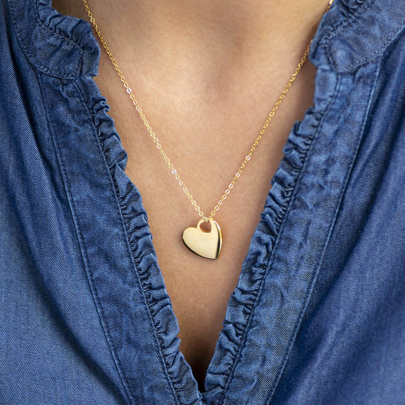 Image shows model wearing Polished Gold Cut Out Heart Necklace