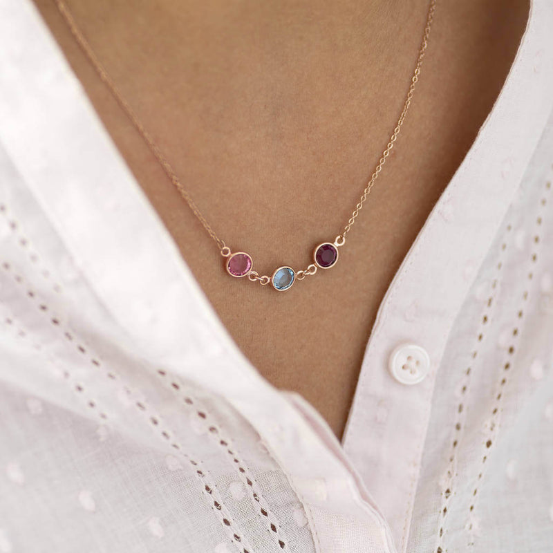 Image shows model wearing rose gold birthstone necklace