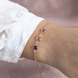 Image shows model wearing rose gold family birthstone bracelet