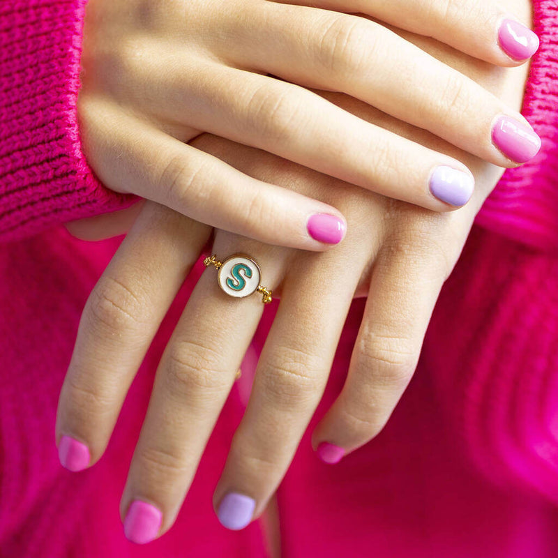 Image shows model wearing Round Enamel Initial Chain Slider Ring with the initial S