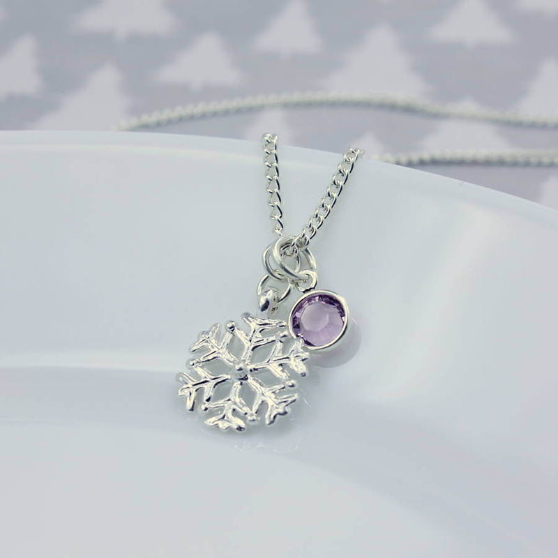 Image shows silver snowflake birthstone charm necklace with June birthstone