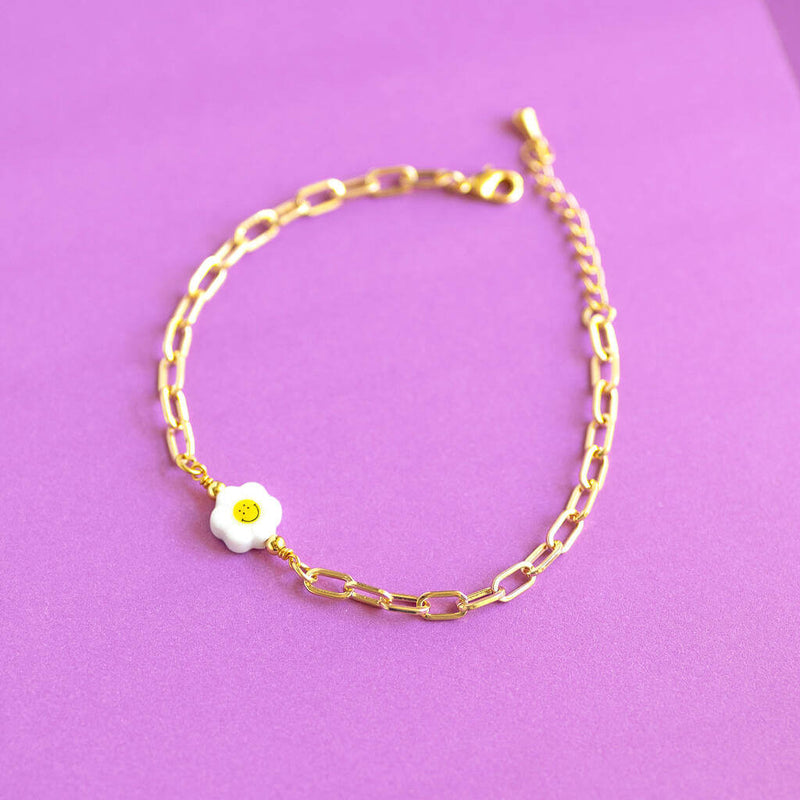 Image shows Image shows model wearing Smiley Face Flower Chunky Chain Bracelet on a purple background