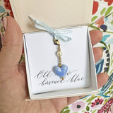 Image shows gold Something Blue Ceramic Heart Keepsake Charm in a gift boxing old, new, borrowed blue sentiment card