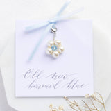 Something blue pearl flower charm on a Old, New,Borrowed Blue sentiment card