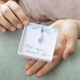 Model holds something blue Swarovski crystal bridal charm on an 'old, new' borrowed, blue' sentiment card attached with a blue ribbon within JOY giftbox,
