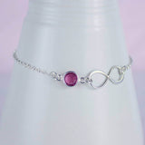 Image shows Sterling Silver Infinity Birthstone Bracelet with ~October birthstone
