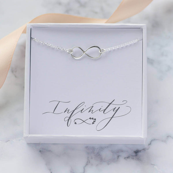 Image shows Sterling Silver Infinity Bracelet in a gift box on an infinity sentiment card