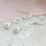 Image shows Sterling Silver Infinity Pearl Earrings