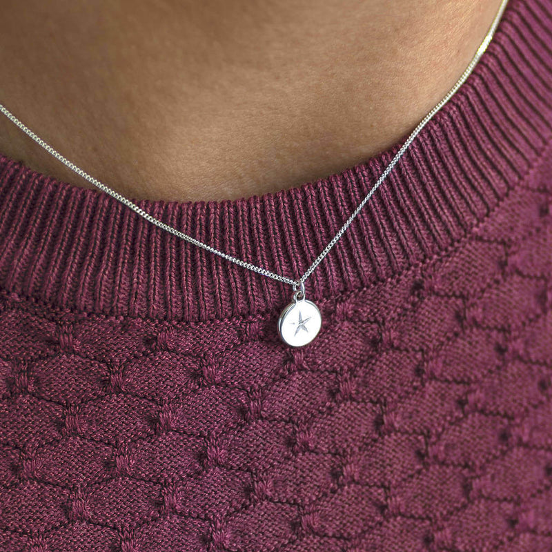 Image shows model wearing Sterling Silver Pendant Necklace with Star Motif