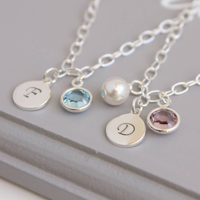 Image shows two sterling silver personalised birthstone bracelets