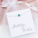 Image shows Sterling Silver Swarovski Crystal Birthstone Bracelet on a birthday wishes sentiment card in an organza bag