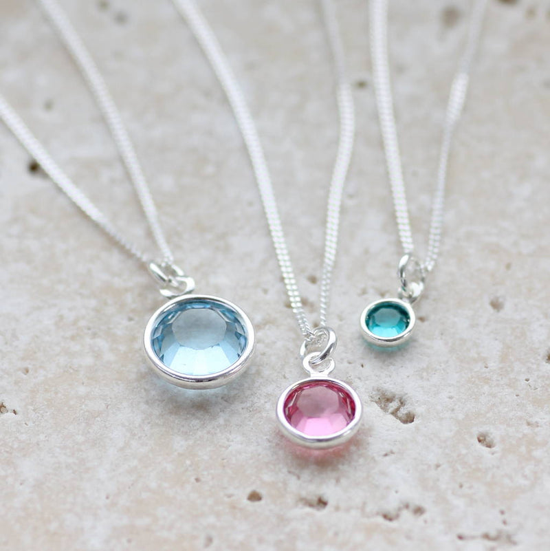Image shows all 3 sizes of the Swarovski crystal birthstone pendant necklaces