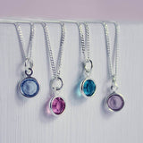 Image shows a selection of Image shows all 3 sizes of the Swarovski crystal birthstone pendant necklaces