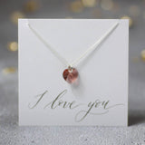 Image shows blush pink Swarovski Crystal Heart Necklace on a I love you  sentiment card