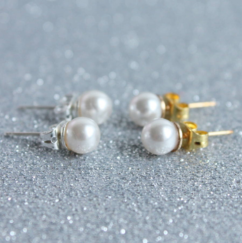Image shows silver and gold Swarovski Pearl Stud Earrings