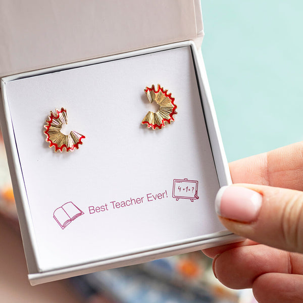 Image shows a pair of Teacher Gift Pencil Shaving Earrings on a 'best teacher ever' sentiment card in a gift box.