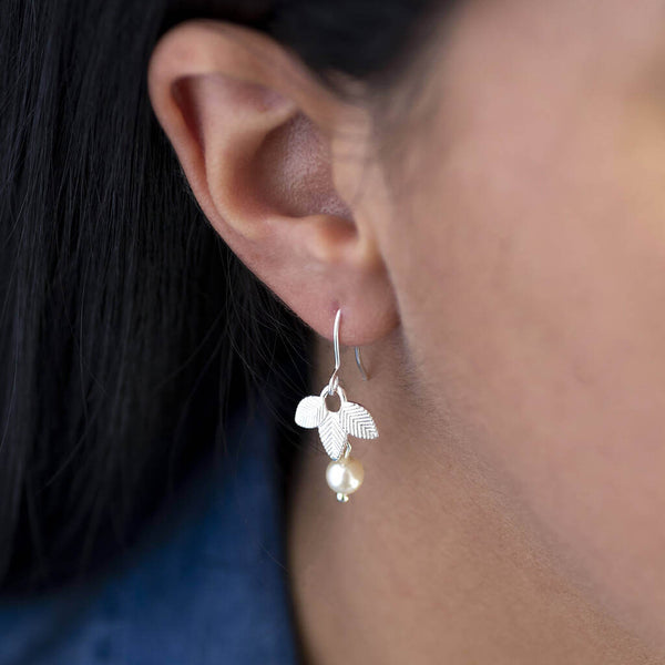 Image shows model wearing Triple Leaf Pearl Drop Earring