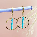 Image shows Turquoise Beaded Stack Crystal Earrings hand from a grey pole