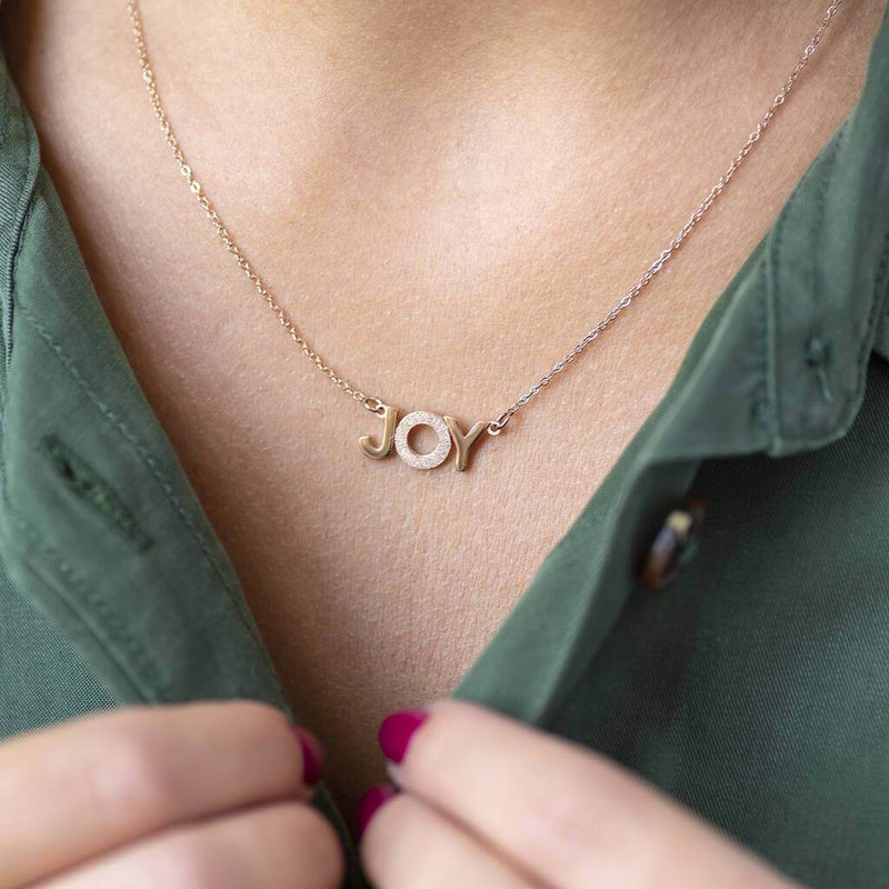 Image shows model wearing rose gold Wear It With JOY Necklace