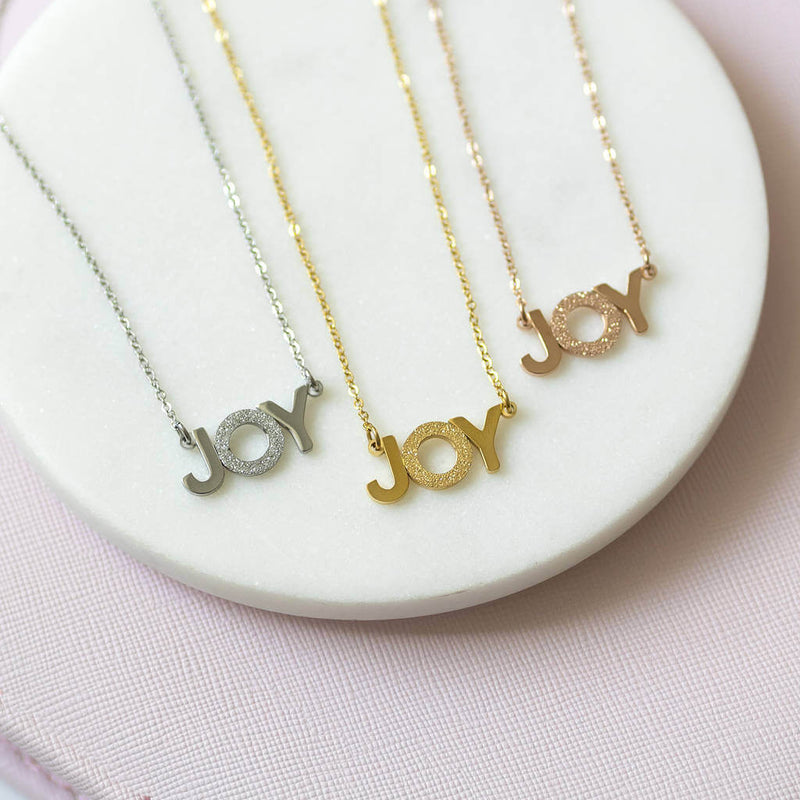 Image shows silver, gold and rose gold Wear It With JOY Necklace