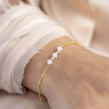 Image shows model wearing  gold White Opal Swarovski Crystal Bar Bracelet