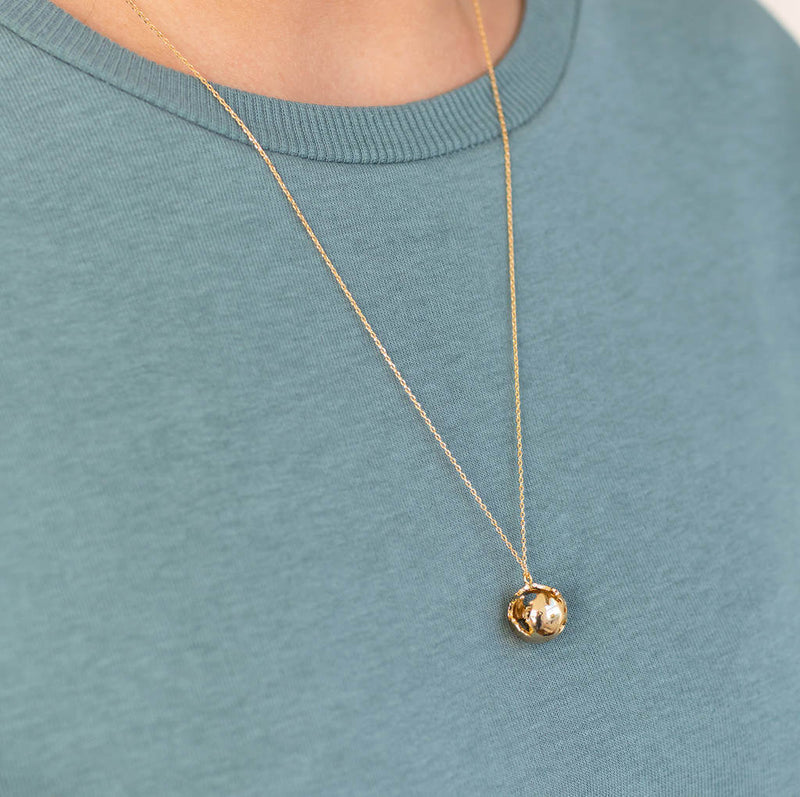 Image shows model wearing rose gold You Are My World Globe Necklace