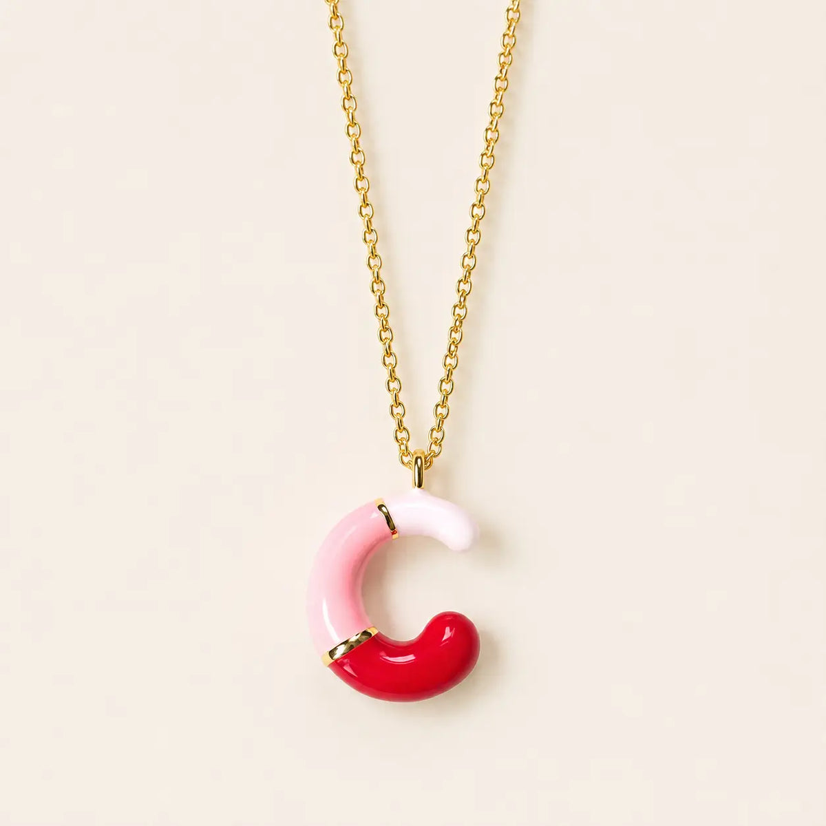 Pink enamel personalised initial necklace with C letter pendant on a gold chain