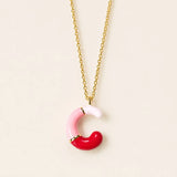Pink enamel personalised initial necklace with C letter pendant on a gold chain