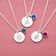 Modern silver plated initial disc necklaces with vibrant birthstone charms, perfect for stacking and everyday jewellery