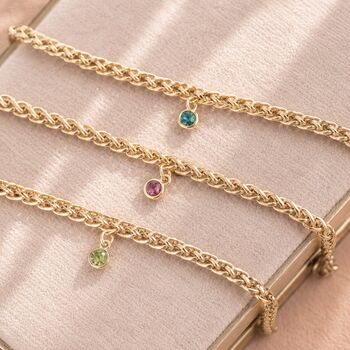 Gold plated rope chain birthstone bracelets with colourful crystal charms, bold personalised jewellery for layering.