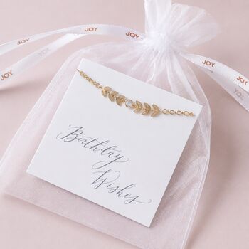 Gold plated vine birthstone bracelet on a 'Beautiful Wishes' card in a soft organza gift bag with branded ribbon detail