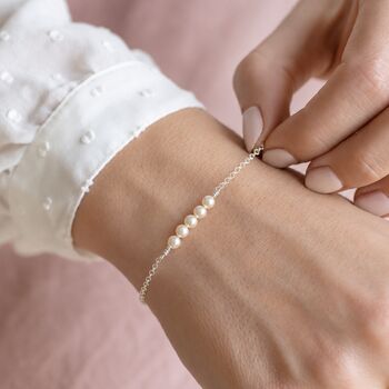 Sterling silver Swarovski pearl bracelet with four pearls, delicate jewellery for layering with classic pieces.
