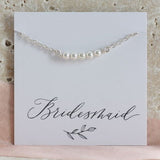 Sterling silver Swarovski pearl bracelet on a Bridesmaid sentiment card, timeless jewellery with elegant pearl details.