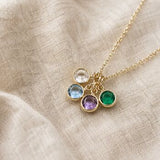Gold plated birthstone charm pendant with colourful crystal charms, elegant jewellery for layering and styling.