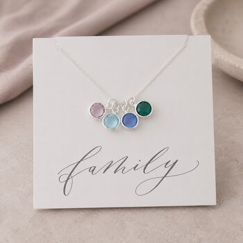 Silver family birthstone charm pendant on a Family keepsake card, colourful personalised jewellery for everyday wear.