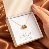 Gold birthstone rings necklace in gift packaging, colourful crystal ring charms on a delicate chain