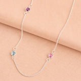Silver long birthstone necklace with pink, purple and blue crystal accents, colourful layered jewellery with a modern finish.