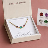Gold plated birthstone bracelet with three colourful crystal charms in a JOY gift box, perfect for layered styling.