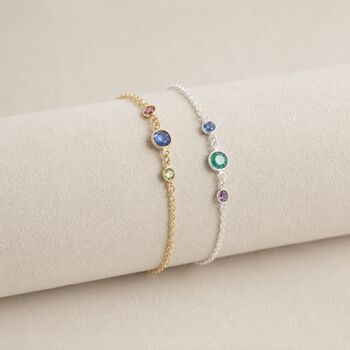 Gold and silver birthstone bracelets with colourful crystal charms, delicate stacking jewellery for personalised style.