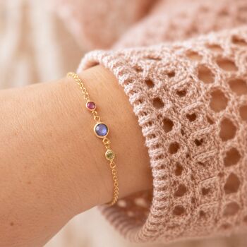 Gold plated birthstone bracelet with three colourful crystals, delicate personalised jewellery for stacking and everyday wear.