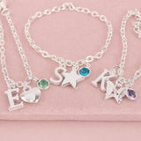 Silver children's charm bracelets featuring letter charms, colourful birthstones and fun motifs