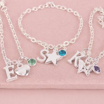 Silver children's charm bracelets featuring letter charms, colourful birthstones and fun motifs