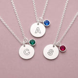 Silver plated modern initial disc necklaces with colourful birthstone charms for personalised everyday layering