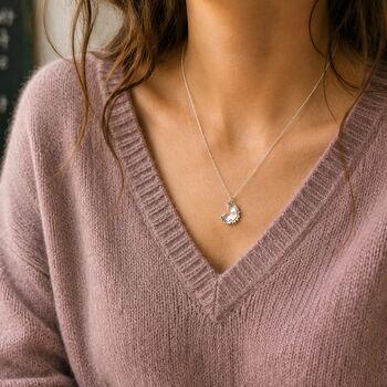 Silver pencil shaving pendant necklace styled with lilac knitwear, quirky everyday jewellery on fine chain

