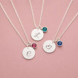 Silver plated initial disc necklaces with colourful birthstone charms, perfect for layering or everyday personalised style