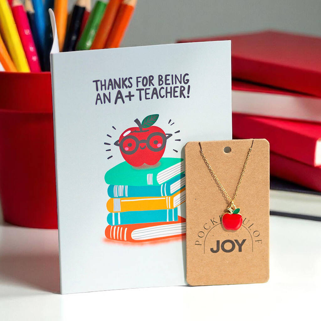 Teacher thank you card with illustrated apple and books, paired with red enamel apple necklace gift set