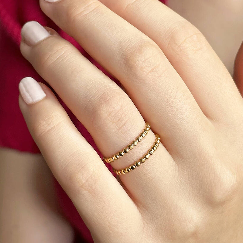 Image shows model wearing adjustable double band dotted ring
