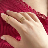 Image shows model wearing a double and triple band adjustable gold ring