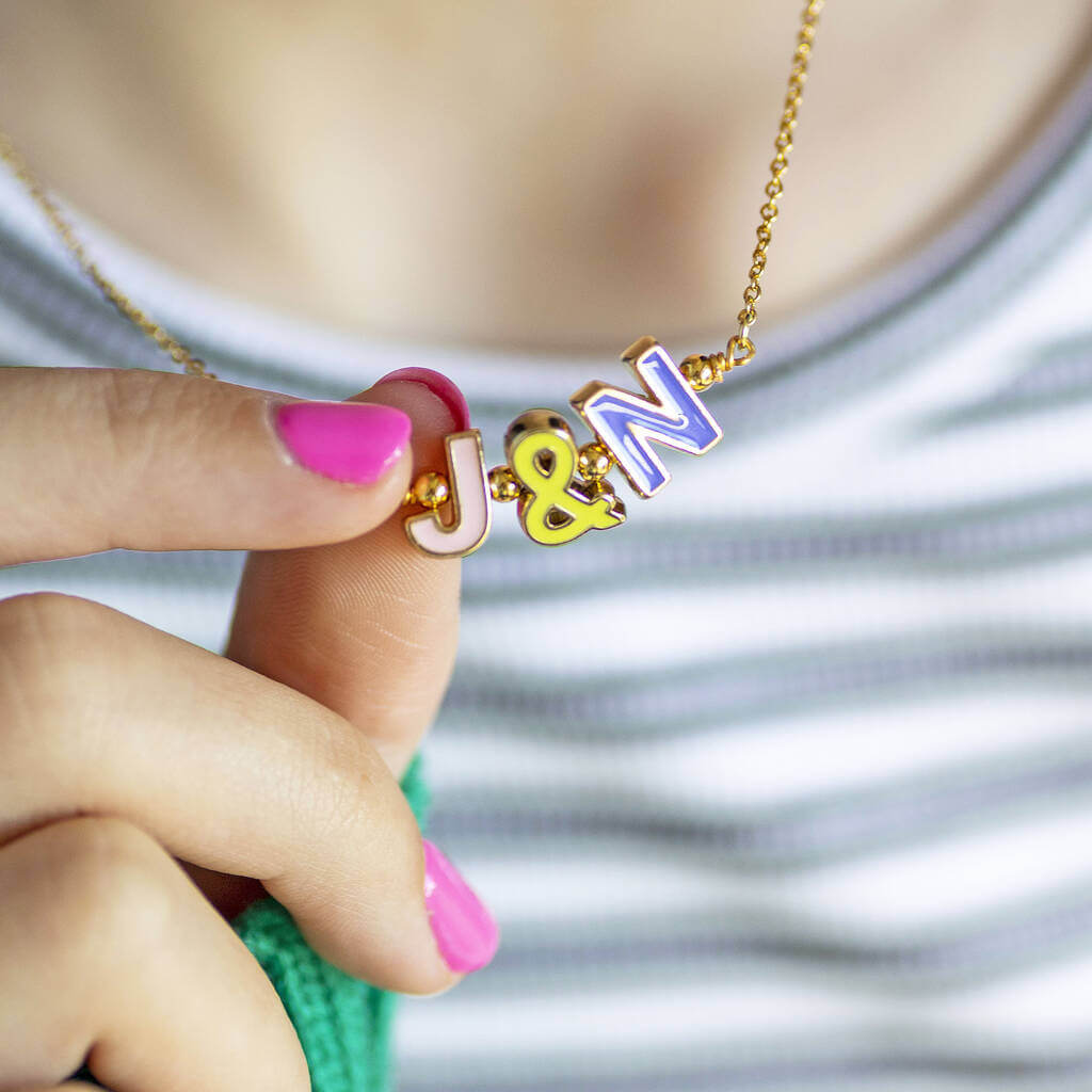 Model wears Best Friends Necklace with Enamel Initials "J&N"