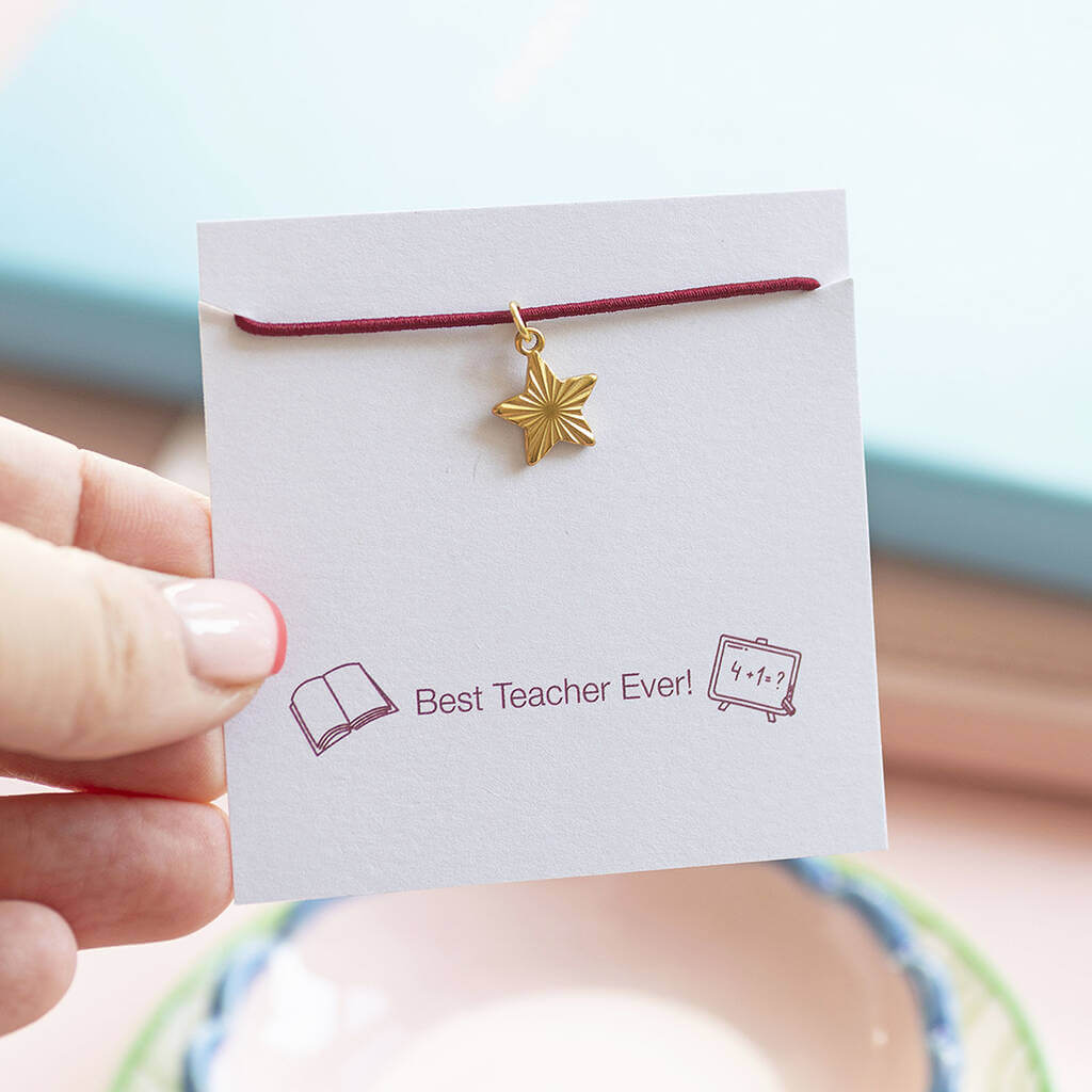 Burgundy coloured stretch cord bracelet with a floating gold textured heart charm.